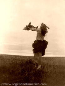 Mandan man offering the buffalo skull.
