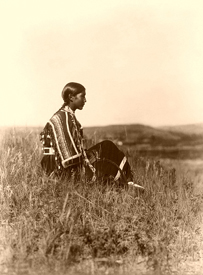 Piegan woman seated on the hill, 1910, Edward S. Curtis