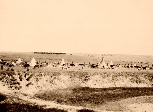U.S. Troops surrounded the battlefield at Wounded Knee, re-enactment photo by James A. Miller, 1913.