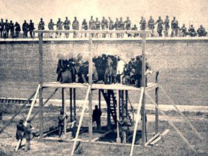 Execution of Mary Surratt, Lewis Powell, David Herold, and George Atzerodt on July 7, 1865, at Fort McNair in Washington City. Photo by Alexander Gardner.