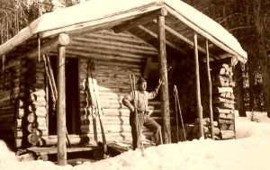 Ranger in front of one of the backcountry cabins.
