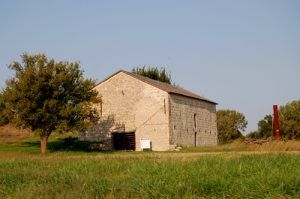 This limestone barn was built by Seth Hays for his livestock. It was later used as a "Poor House." Today, it is listed on the national Register of Historic Places. by Kathy Weiser.