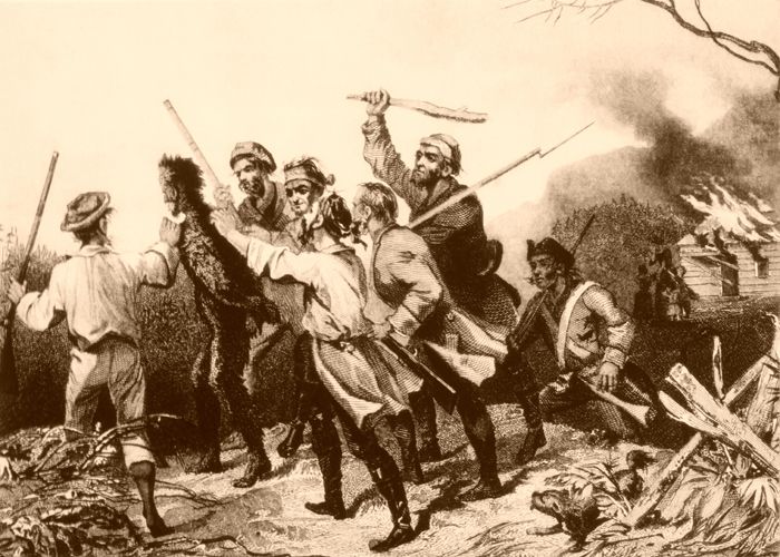 Rebels tarring and feathering a tax collector in western Pennsylvania during the Whiskey Rebellion