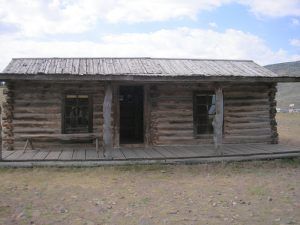 Hole in the Wall Cabin at Old Town, Cody, Wyoming by Kathy Alexander