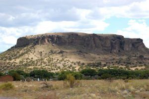 La Capilla de la Familia Sagrada Chapel and cemetery at the base of Black Mesa on the San Ildefonso Pueblo Reservation. Photo by Kathy Alexander.
