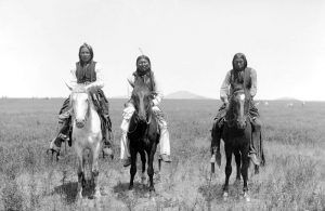 Three mounted Comanche warriors, 1892.