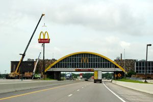 Construction crew beginning to dismantle the McDonalds Facade in Vinita, Oklahoma by Kathy Weiser-Alexander.