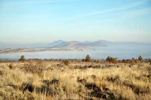 Fog shrouded Tule Lake at the Lava Beds National Monument in California by the National Park Service.