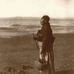 Chinook woman on the beach by Edward S. Curtis, 1910.