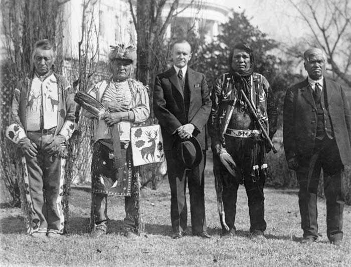 President Calvin Coolidge with four Osage Indians after Coolidge signed<br />the bill granting Indians full citizenship in 1924.