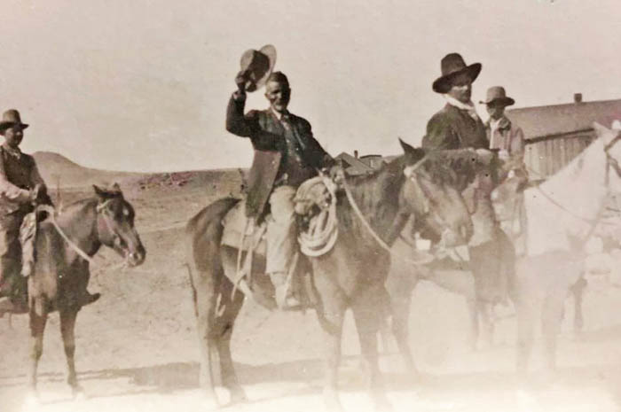 George McJunkin (center), outside his home in Folsom, New Mexico.