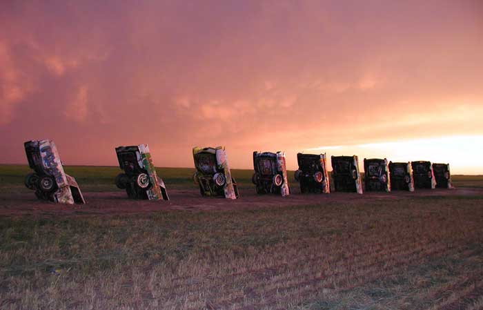 A storm rolls in at Cadillac Ranch near Amarillo, Texas. Photo by Dave Alexander.
