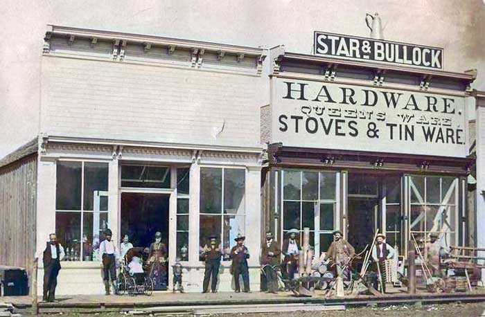Star & Bullock Hardware Store on the corner of Wall and Main Streets, 1877. Colorized